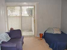 bedroom with doorwall to patio