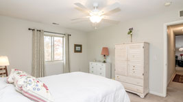 master bedroom with walk in closet