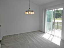 dining area with doorwall to deck