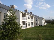 screened porch overlooks grassy commons