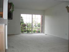 living room with doorwall to patio