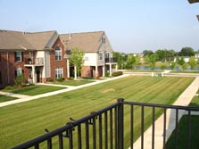 deck overlooks grassy commons