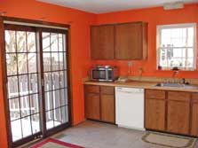kitchen with doorwall to fenced yard