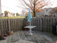 fenced yard with deck