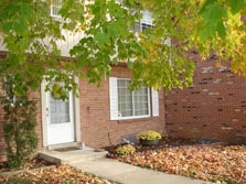 pleasant front entrance & flower beds