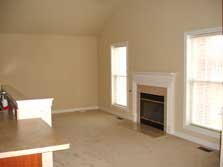 living room with cathedral ceiling & fireplace