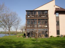 many units have screened-in porches overlooking Ford Lake