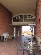 covered paved walkway w/sidewalk cafe